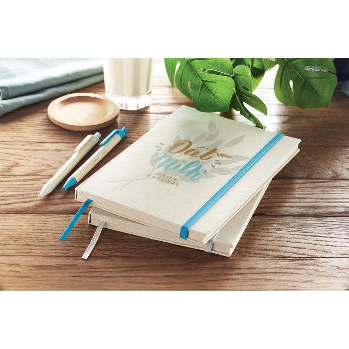 Branded A5 Recycled Milk Carton Notebook in use
