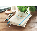 Branded A5 Recycled Milk Carton Notebook in use