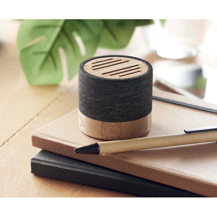 Branded 5.0 Round Wireless Speaker in use