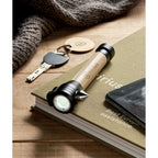 Branded Bamboo Torch with Emergency Hammer in use