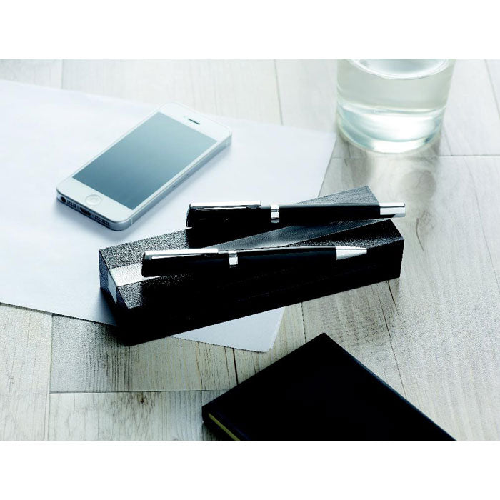 Branded Brass and Steel Pen and Roller Set in use