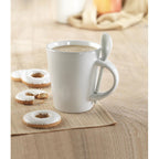 Branded sublimation mug with spoon, in use
