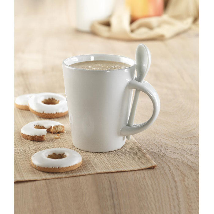 Branded sublimation mug with spoon, in use