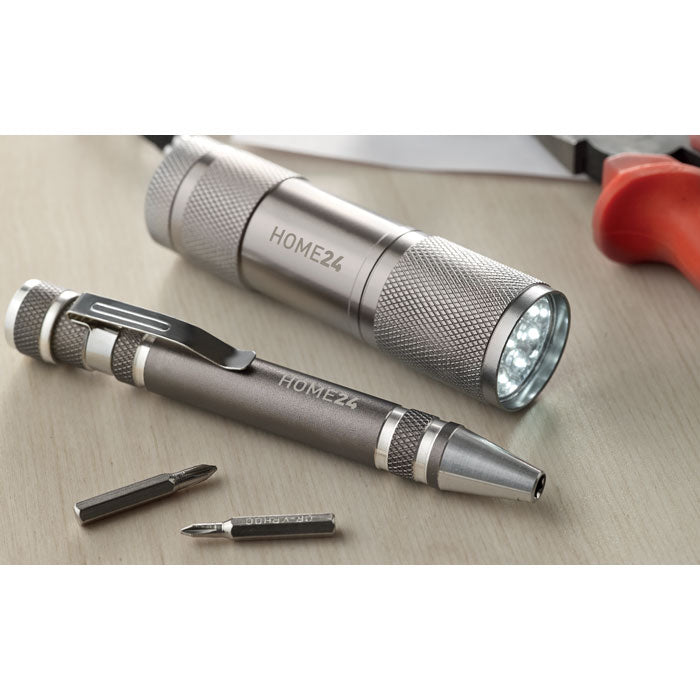 Branded Torch and Multi Tool Pen Set in use