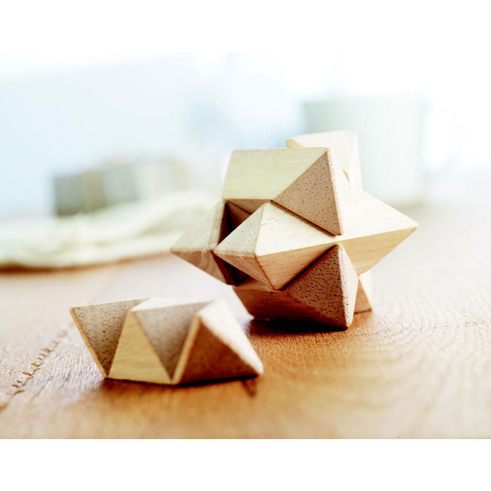 Branded Wooden Star Brain Teaser in use
