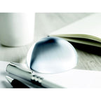 Branded Glass Ball Paperweight with Magnifier in use