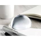 Branded Glass Ball Paperweight with Magnifier in use
