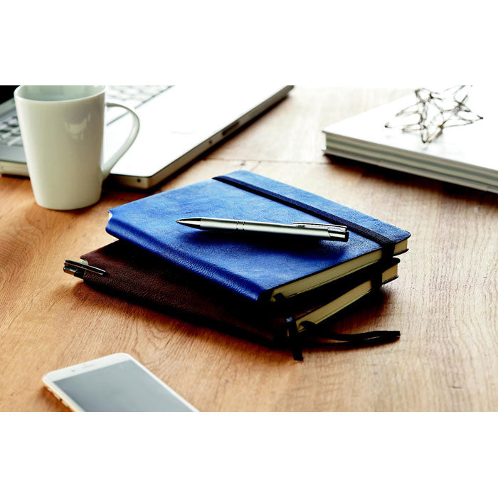 Branded A5 Soft PU Notebook with Pen Holder in Spine in use
