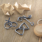 Branded Set of 3 Metal Brain Teasers in use