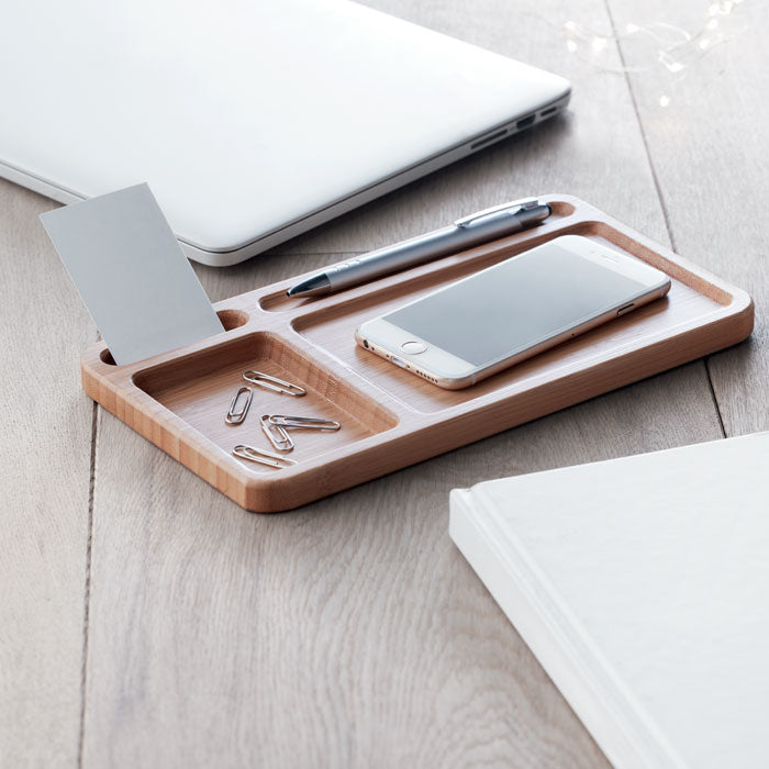 Branded Bamboo Desk Storage with Wireless Charger in use