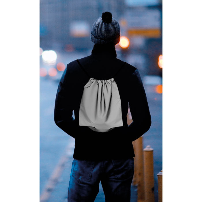 Branded Reflective Drawstring Bag in use