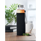 Branded borosilicate glass bottle, in use