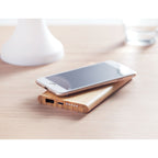 Branded Wireless Charger in Bamboo Casing in use