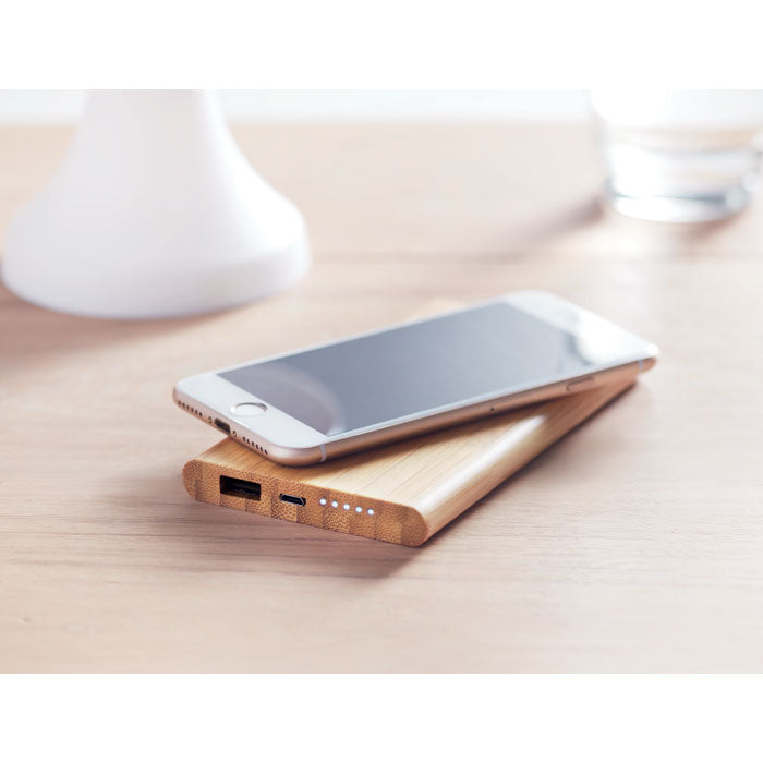 Branded Wireless Charger in Bamboo Casing in use