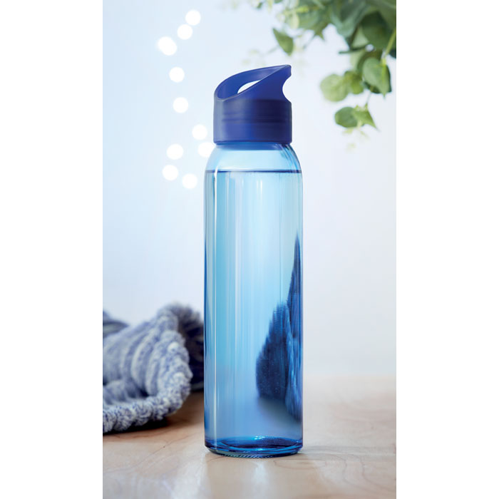 Branded glass bottle, in use