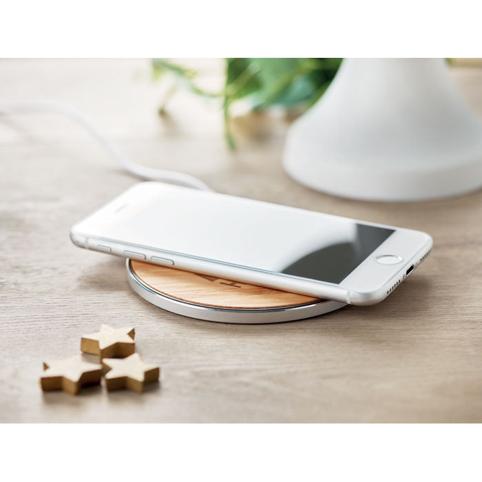 Branded Bamboo and Aluminium Wireless Charger in use