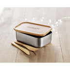 Branded Stainless Steel Lunch Box with Bamboo Lid and Cutlery 600ml in use