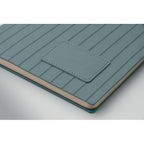 Teal textured notebook with a pocket on a white background