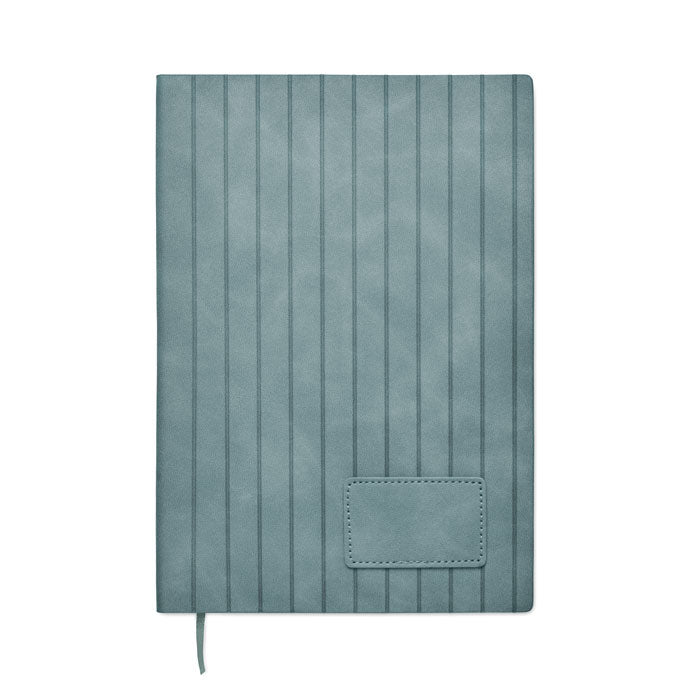 Teal notebook with ribbed texture on a white background