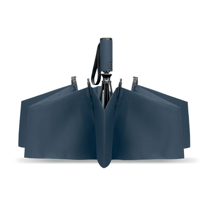 Folded navy blue umbrella on a white background