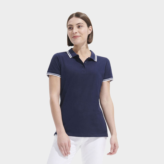 Model wearing a branded fitted stripe women's polo shirt
