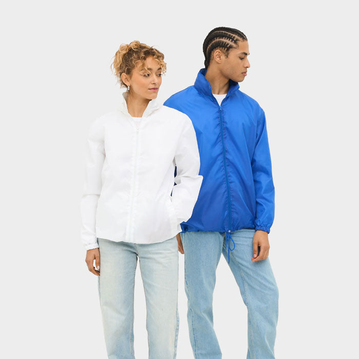 Model wearing a branded water-repellent windbreaker
