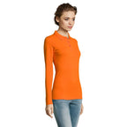 Orange long sleeve women's polo shirt, side view