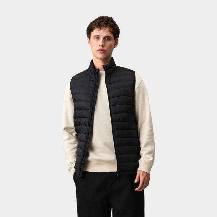 Model wearing a branded men's packable down gilet