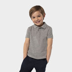 Model wearing a branded premium kids polo shirt