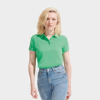 Model wearing a branded organic pique women's polo shirt