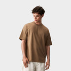 Model wearing a branded boxy men's t-shirt