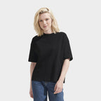 Model wearing a branded boxy women's t-shirt