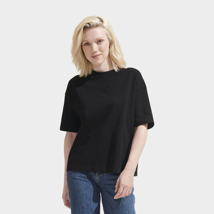 Model wearing a branded boxy women's t-shirt