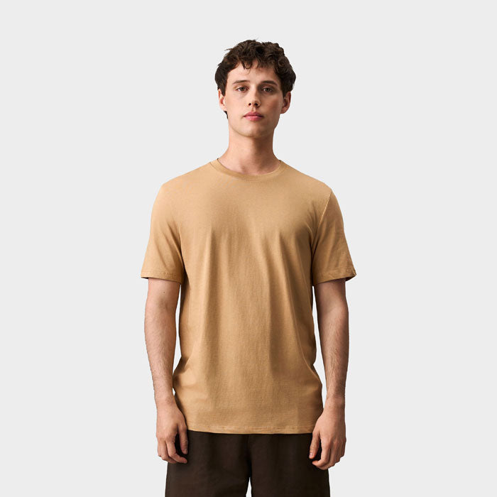 Model wearing a branded organic t-shirt