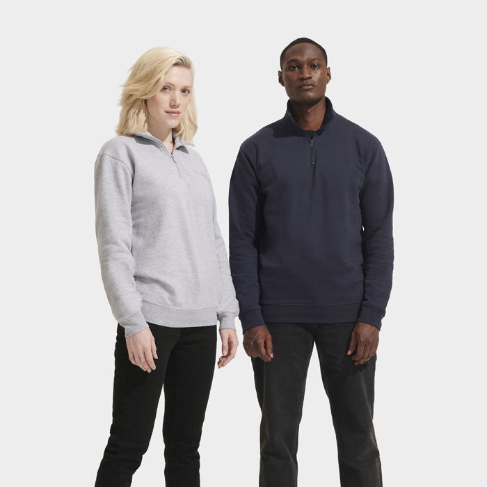 Model wearing a branded quarter-zip sweatshirt
