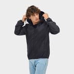Model wearing a branded packable windbreaker