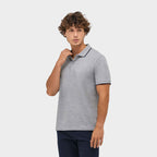 Model wearing a branded contrast stripe polo shirt