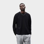 Model wearing a branded recycled oversized long sleeve t-shirt