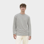 Model wearing a branded long sleeve t-shirt