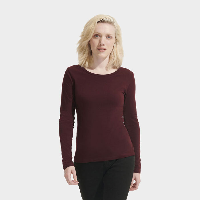 Model wearing a branded fitted long sleeve women's t-shirt