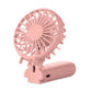 Pink portable fan with USB charging port on a white background
